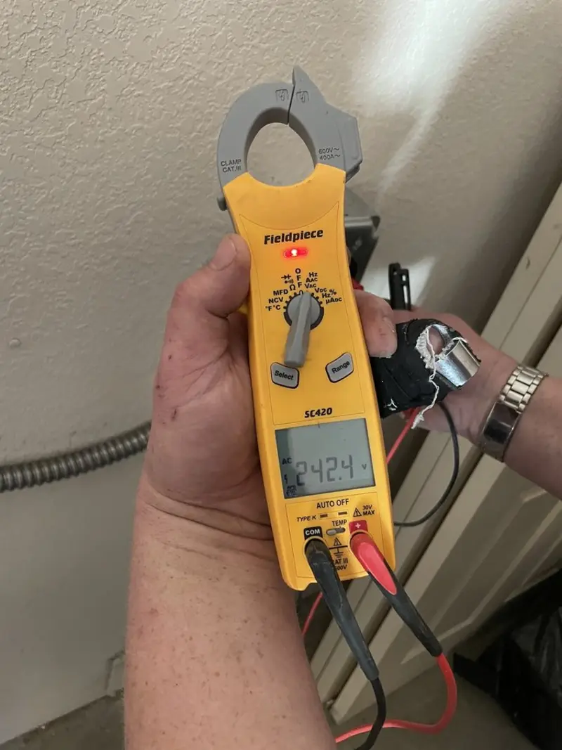 Voltage testing with clamp meter during Whole House Surge Protector in Lonoke